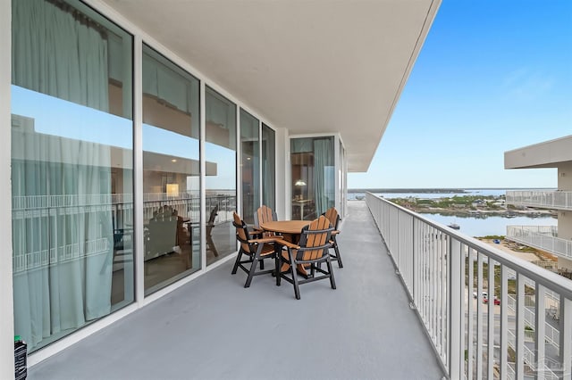 balcony featuring a water view