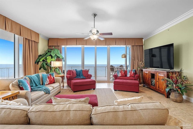 living room with crown molding, a wall of windows, and ceiling fan