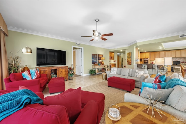 living room with crown molding and ceiling fan