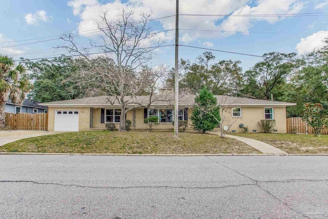 single story home with a garage and a front yard