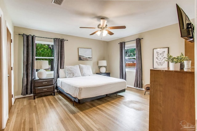 bedroom featuring ceiling fan and light hardwood / wood-style floors