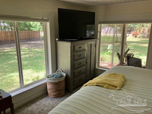 4316 Floridatown Rd, Pace, FL 32571 - carpeted bedroom featuring ornamental molding
