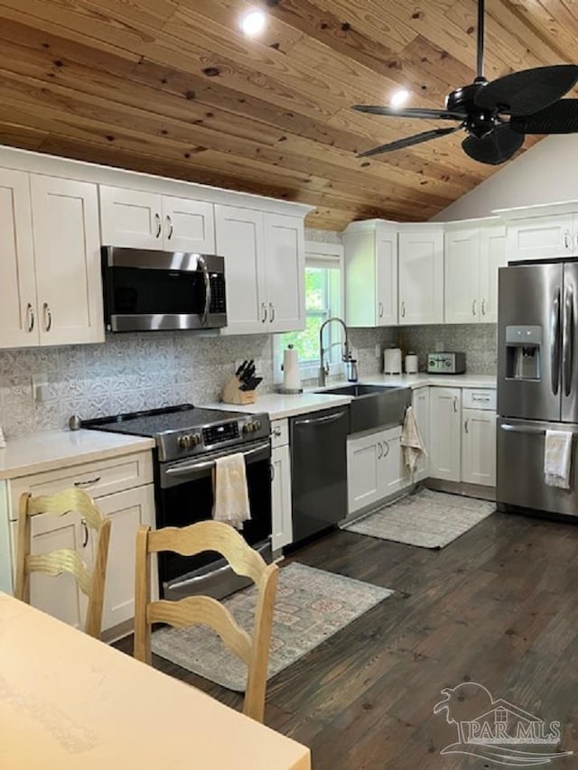 4316 Floridatown Rd, Pace, FL 32571 - kitchen with appliances with stainless steel finishes, wooden ceiling, a ceiling fan, a sink, and light countertops