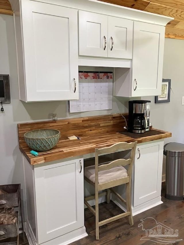 4316 Floridatown Rd, Pace, FL 32571 - kitchen with butcher block countertops, white cabinets, and dark wood-style flooring