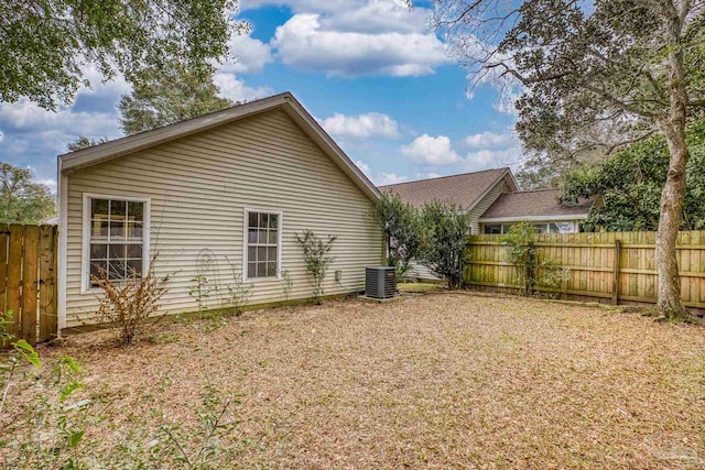 back of house featuring central AC