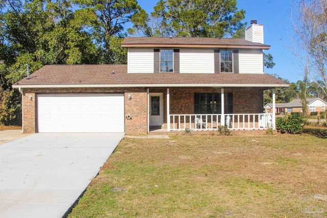 view of front of house with a porch, a garage, and a front lawn