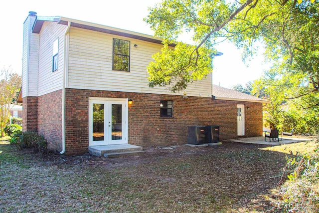 back of house with french doors, cooling unit, and a patio