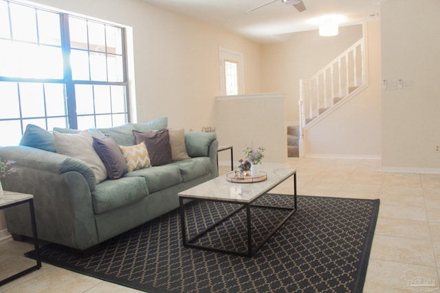 tiled living room with ceiling fan