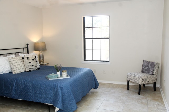 bedroom featuring light tile patterned floors