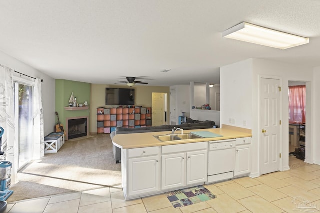 kitchen featuring white cabinetry, dishwasher, ceiling fan, sink, and light tile patterned flooring