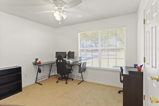 office area featuring ceiling fan and light colored carpet