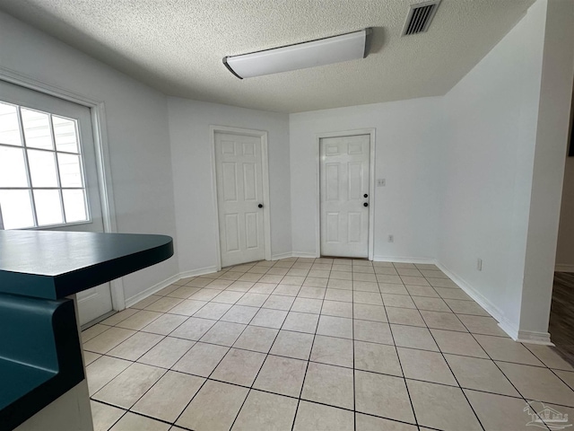 4885 Mayo Cir, Pace, FL 32571 - entryway with a textured ceiling and light tile patterned flooring
