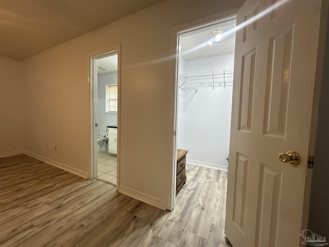 4885 Mayo Cir, Pace, FL 32571 - corridor featuring light wood-style flooring and baseboards