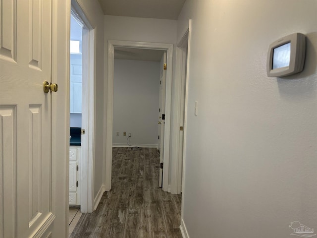 4885 Mayo Cir, Pace, FL 32571 - hall featuring dark wood-style floors and baseboards