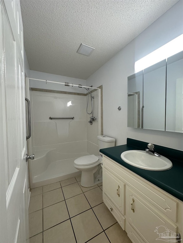 4885 Mayo Cir, Pace, FL 32571 - full bath with vanity, tile patterned flooring, a textured ceiling, a shower, and toilet