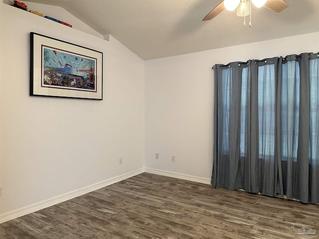 4885 Mayo Cir, Pace, FL 32571 - unfurnished room with dark wood finished floors, ceiling fan, baseboards, vaulted ceiling, and a textured ceiling