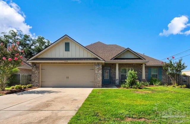 view of front facade with a garage and a front lawn