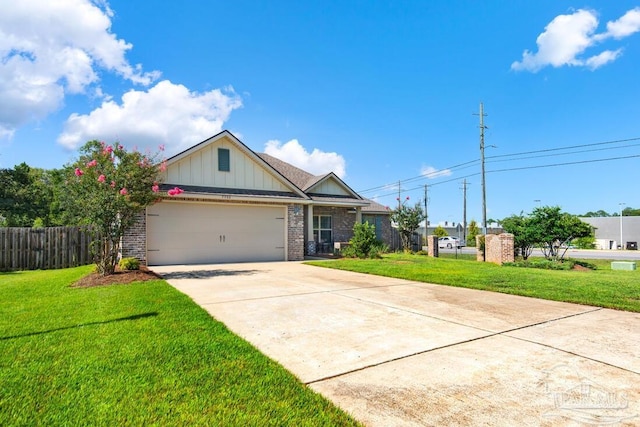 view of front of house with a front yard and a garage