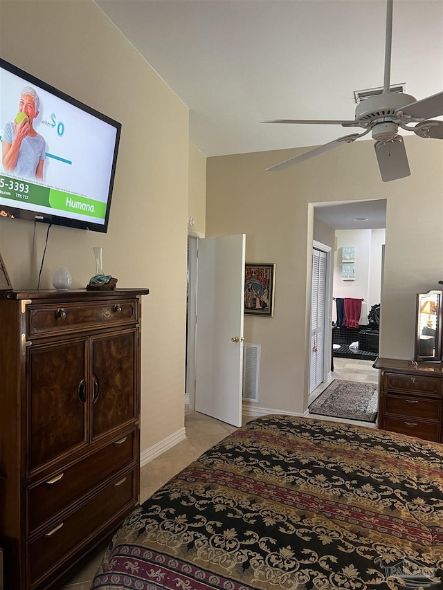 bedroom featuring light tile patterned floors and ceiling fan