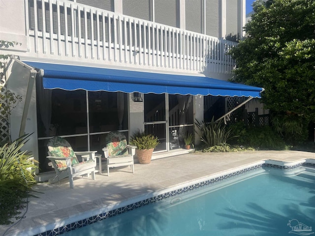 view of swimming pool with a patio area