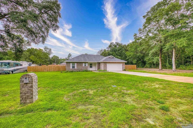 single story home featuring a garage and a front yard