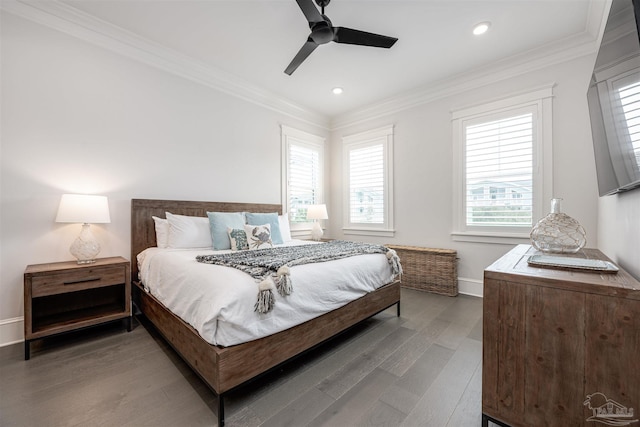 bedroom with ceiling fan, dark hardwood / wood-style flooring, and ornamental molding