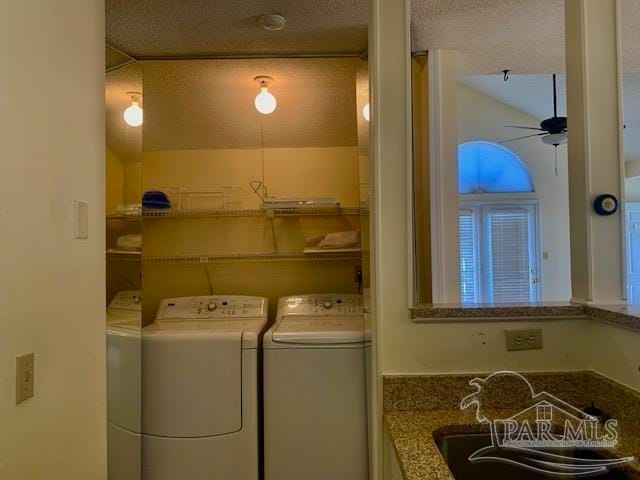 laundry room with sink, a textured ceiling, ceiling fan, and washer and dryer