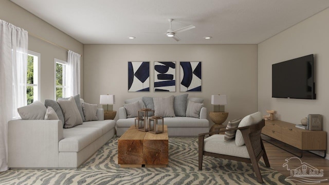 living area with wood finished floors, a ceiling fan, and recessed lighting