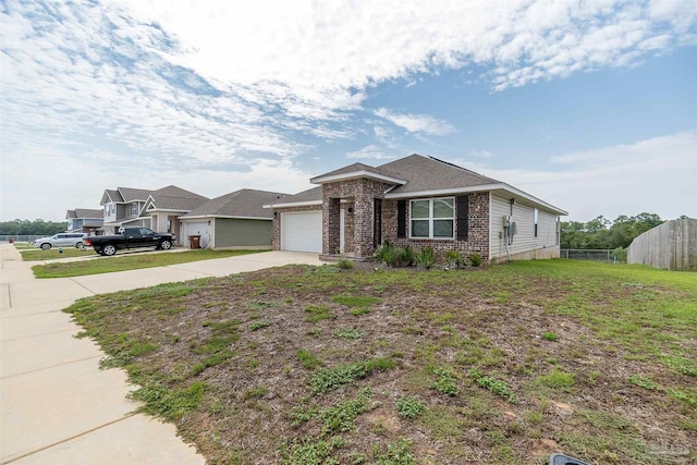 single story home featuring a garage and a front lawn