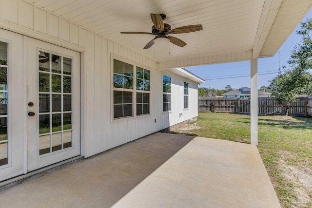 view of patio / terrace with fence and a ceiling fan