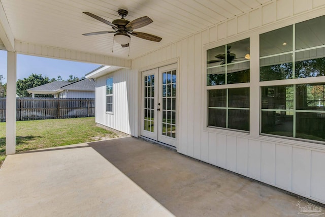 view of patio featuring ceiling fan, fence, and french doors