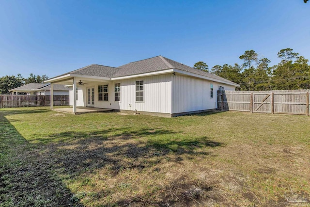 rear view of property featuring a yard, a patio area, a fenced backyard, and ceiling fan