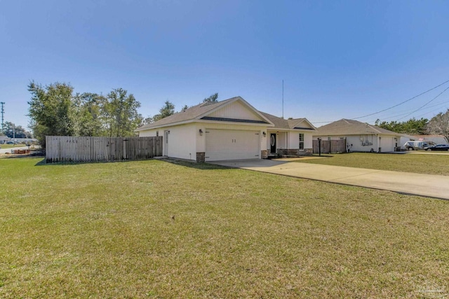 ranch-style home with concrete driveway, a front yard, fence, a garage, and stone siding