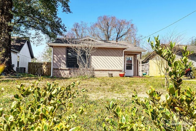 view of front of home featuring fence