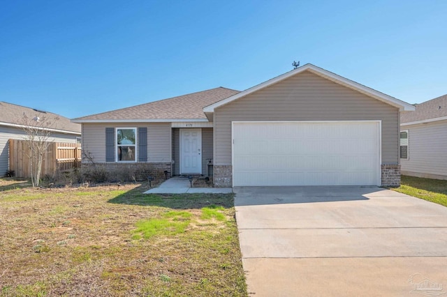 ranch-style house with a front yard, concrete driveway, fence, and an attached garage