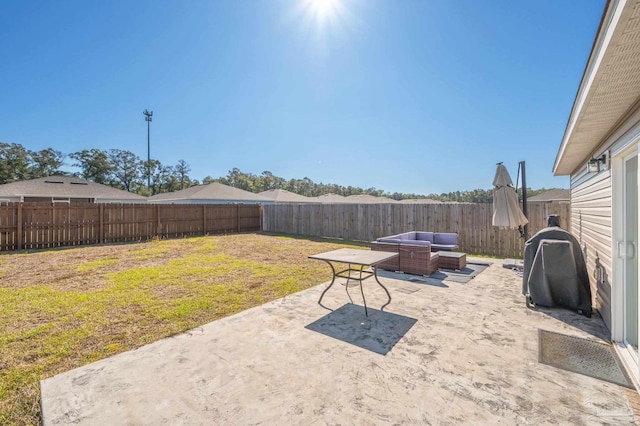 view of yard featuring a patio area, a fenced backyard, and an outdoor living space