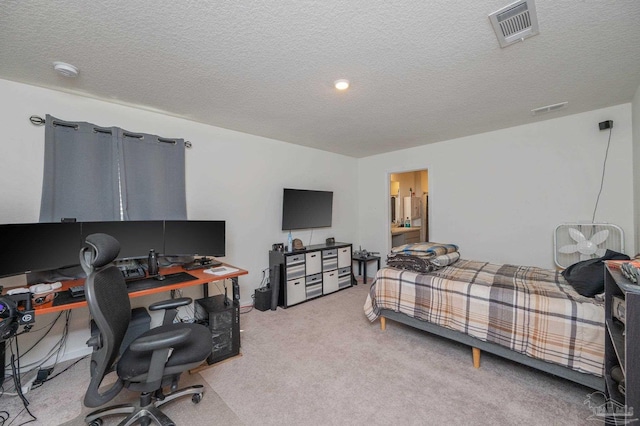 bedroom with visible vents, a textured ceiling, and light colored carpet