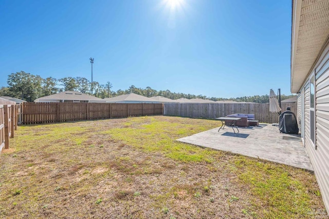 view of yard with a fenced backyard and a patio