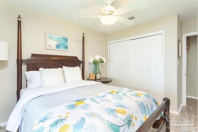 bedroom with a closet, ceiling fan, and hardwood / wood-style flooring