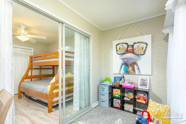 bedroom with ceiling fan and a closet