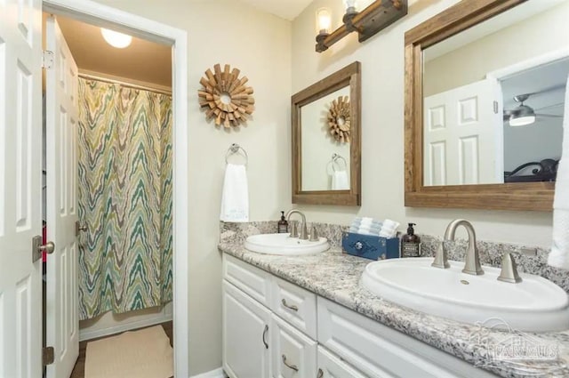 bathroom with walk in shower and vanity