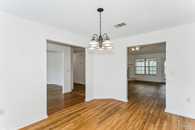 4803 Jaimee Leigh Dr, Milton, FL 32570 - unfurnished room with light wood-style floors, a chandelier, ceiling fan, and baseboards