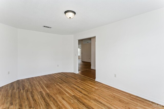 4803 Jaimee Leigh Dr, Milton, FL 32570 - spare room featuring wood finished floors and baseboards