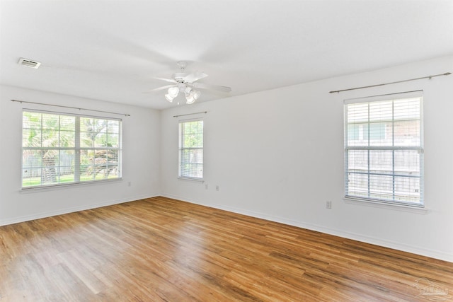 4803 Jaimee Leigh Dr, Milton, FL 32570 - empty room with light wood-style floors, ceiling fan, and baseboards