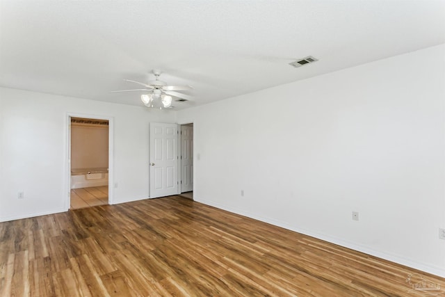 4803 Jaimee Leigh Dr, Milton, FL 32570 - empty room featuring a ceiling fan, wood finished floors, and baseboards