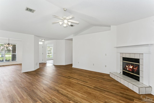 4803 Jaimee Leigh Dr, Milton, FL 32570 - unfurnished living room with a fireplace, lofted ceiling, a ceiling fan, wood finished floors, and a chandelier