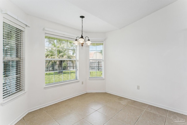 4803 Jaimee Leigh Dr, Milton, FL 32570 - unfurnished dining area featuring a chandelier, light tile patterned floors, and baseboards