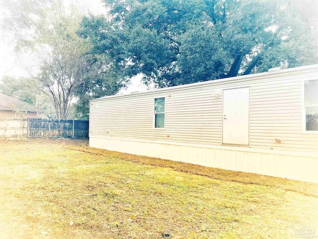 view of home's exterior with a lawn