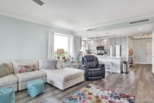living room featuring ornamental molding, dark wood finished floors, and baseboards