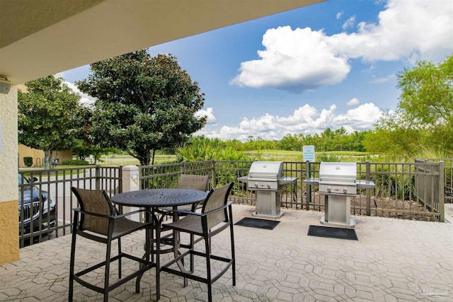view of patio with a grill and outdoor dining space